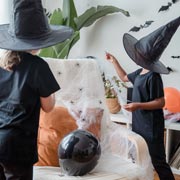 Witch or wizard outfits can be made from any type of black clothing and pointy hats can be made using black card and tape.